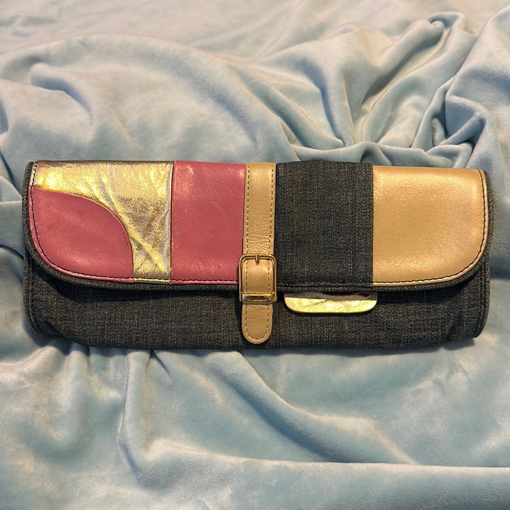 Malini Sulaika jean and leather clutch